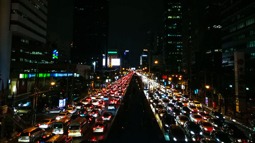 Cars on road in city at night