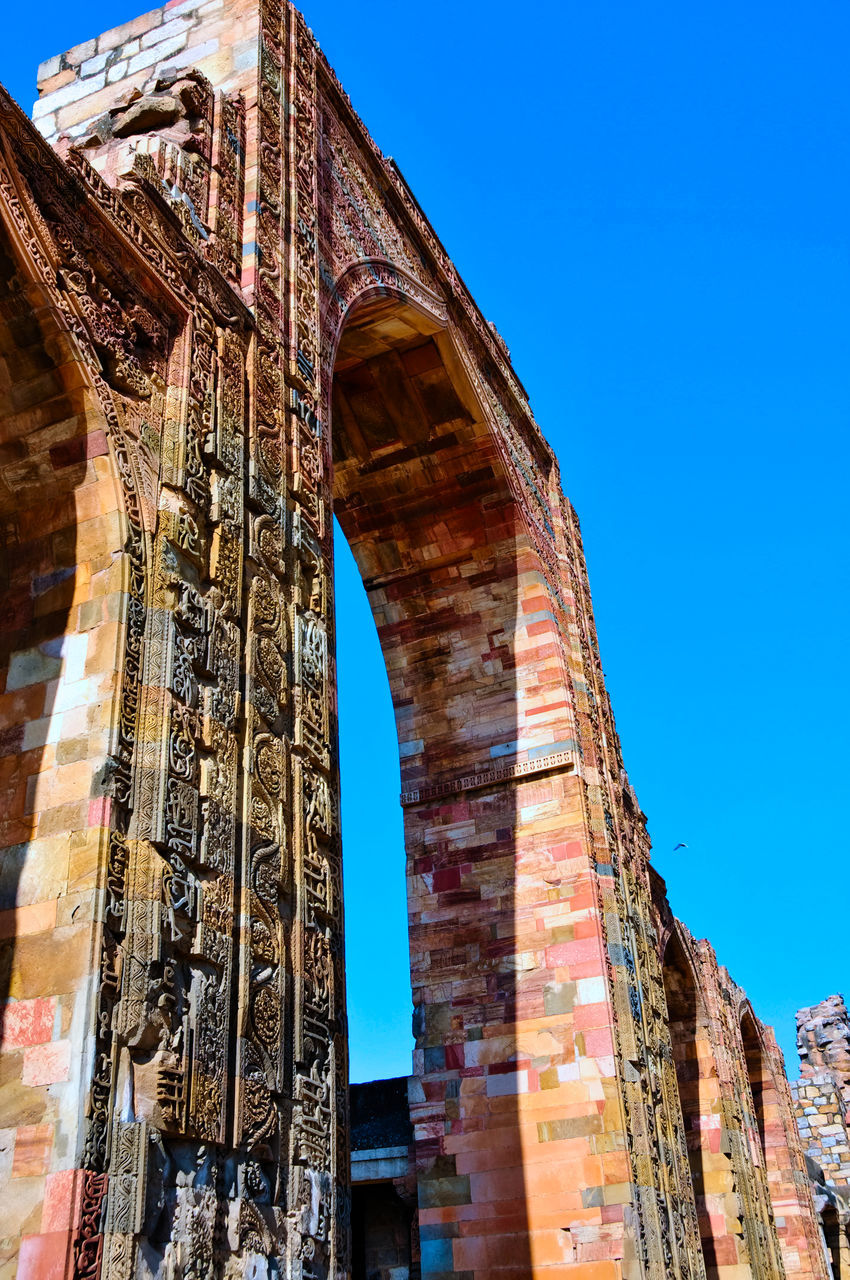 landmark, architecture, built structure, travel destinations, sky, clear sky, history, building exterior, blue, the past, travel, low angle view, arch, nature, city, no people, tourism, cityscape, day, sunny, ancient history, outdoors, urban area, tower, ancient, bridge, old, brick