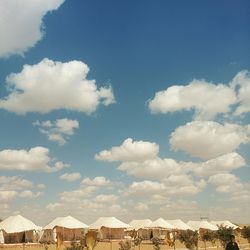 Built structure against blue sky and clouds