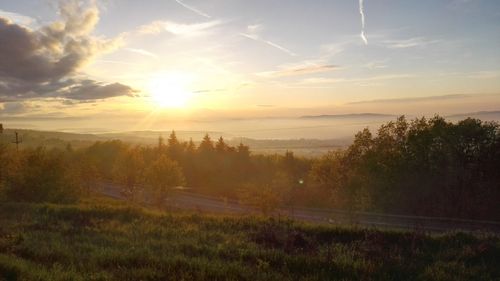 Scenic view of landscape against sky during sunset