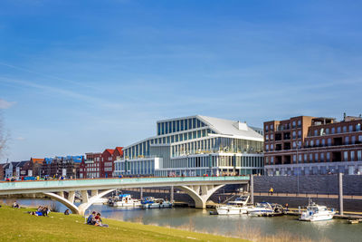 Bridge over river with buildings in background