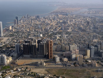 High angle view of modern buildings in city against sky