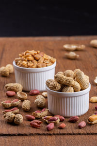 Close-up of breakfast on table against black background