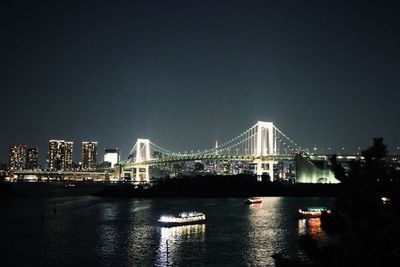 Illuminated city at waterfront