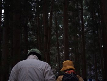 Low section of man standing in forest