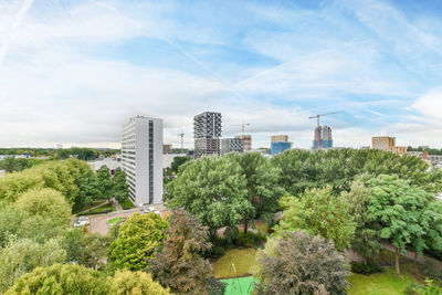 Buildings in city against sky