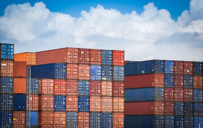 Stack of commercial dock against sky