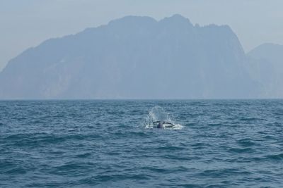 Scenic view of sea and mountains