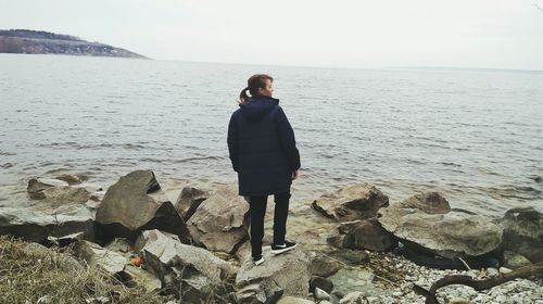 Full length of woman standing on shore