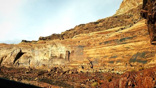 Rock formations on land against sky