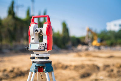 Surveyor equipment tacheometer or theodolite outdoors at construction site