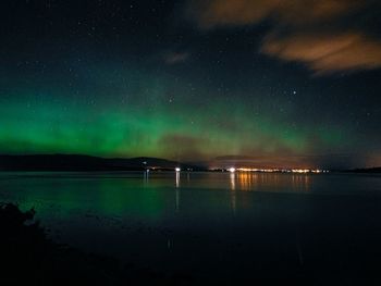 Scenic view of landscape against sky at night