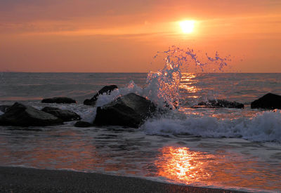 Scenic view of sea against sky during sunset