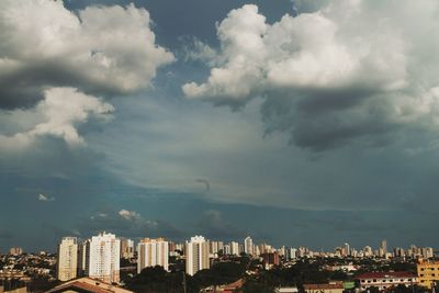 Buildings in city against sky