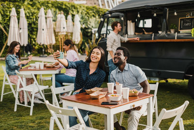 Portrait of woman sitting at outdoor cafe