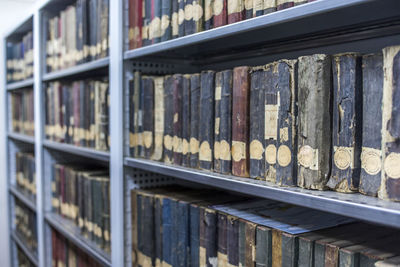 Close-up of vintage books in shelf