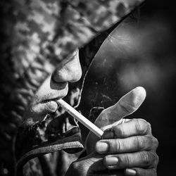 Close-up of man smoking cigarette