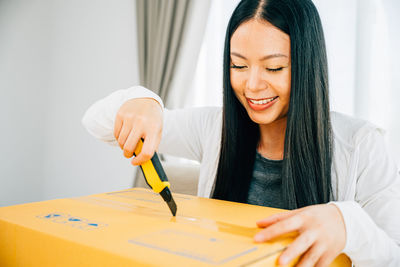 Portrait of young woman working at office