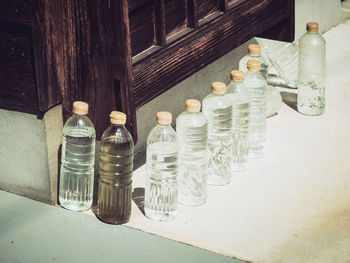 High angle view of bottles on table