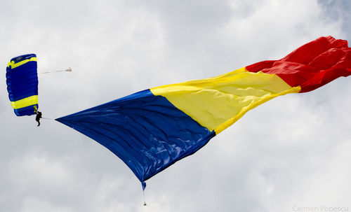 Low angle view of flag against sky