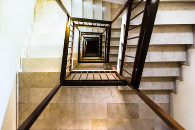 Low angle view of spiral staircase in building