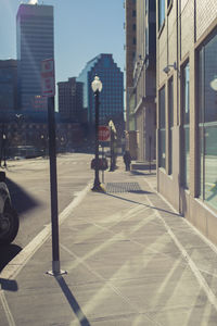 Man in city against sky