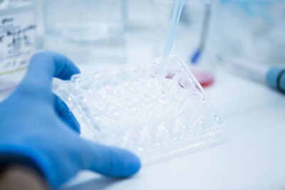 Close-up of scientist examining chemical in laboratory