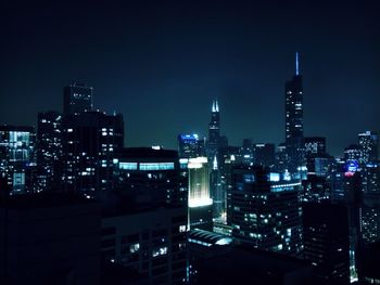 Illuminated cityscape at night