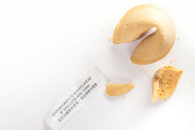 Close-up of bread over white background