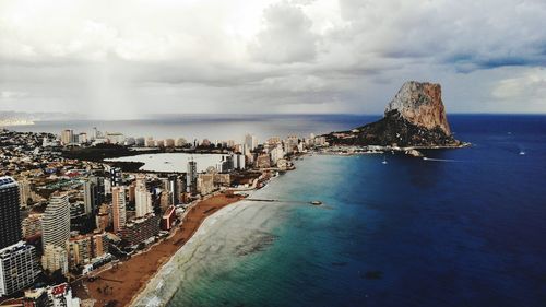 Panoramic view of sea and buildings against sky