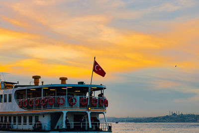 Istanbul city lines ferry near the kadikoy pier at sunset.