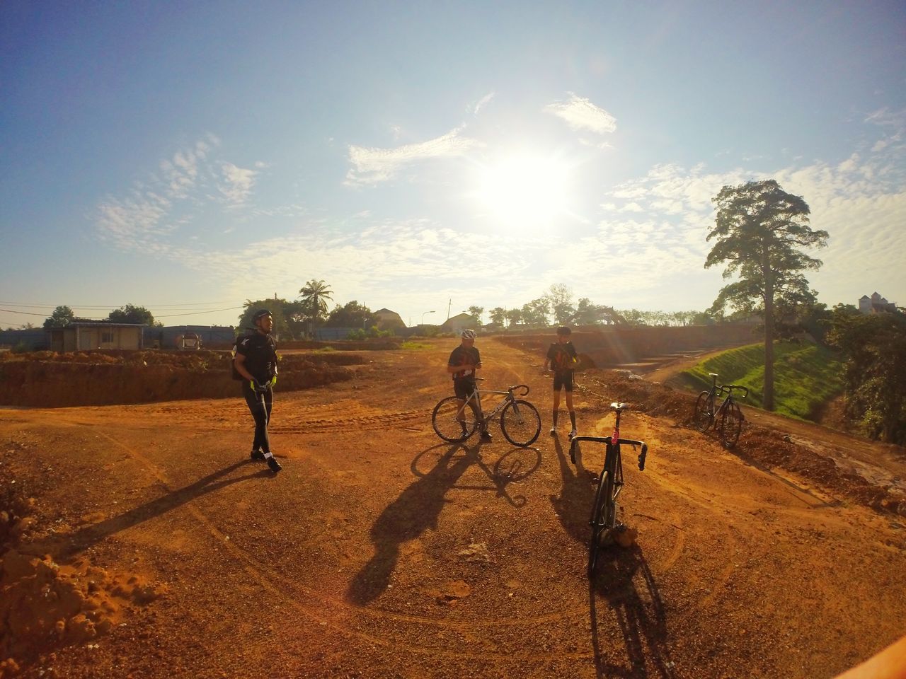 bicycle, lifestyles, leisure activity, sunlight, sky, men, shadow, full length, sun, riding, walking, sand, sunbeam, sunny, tree, transportation, landscape