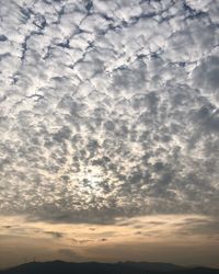 Low angle view of cloudy sky during sunset