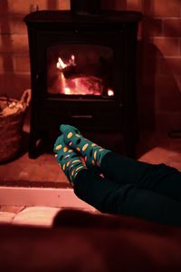 Low section of person relaxing at home