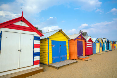 Beach huts against sky