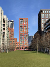 Buildings in city against sky