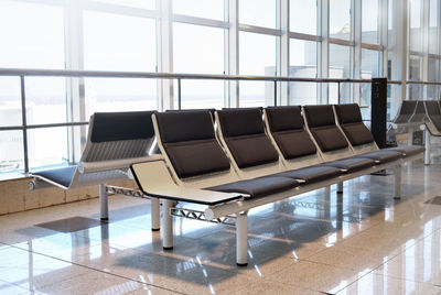 Empty chairs and tables at airport