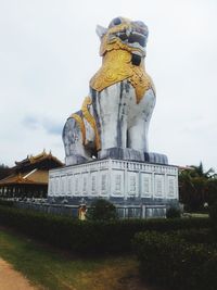 Low angle view of statue against building