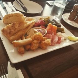 Close-up of serving food on table