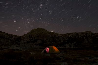 Scenic view of mountains at night