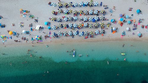 High angle view of people enjoying on beach