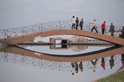 People standing by swimming pool