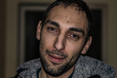 Portrait of young man indoors