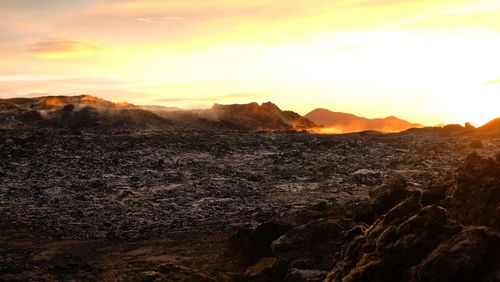 Scenic view of mountains against sky during sunset