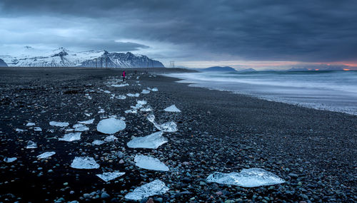 Scenic view of sea against sky during winter