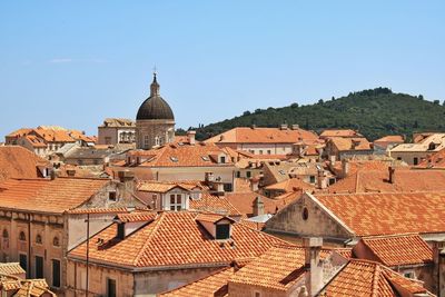 Houses in town against clear sky