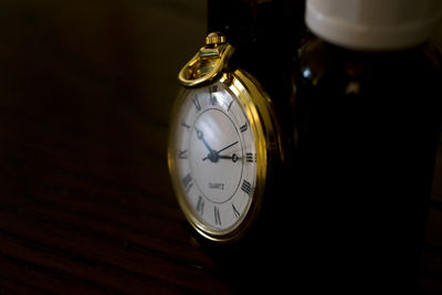 Close-up of clock on table