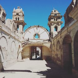 Entrance of historic building against sky