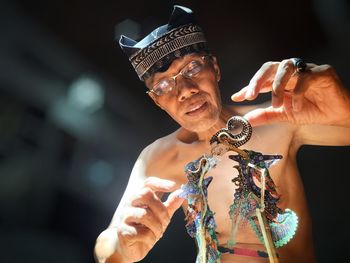 Portrait of young woman drinking water