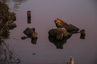 High angle view of rock formation in lake against sky